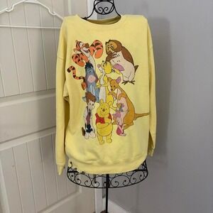 Yellow Disney Winnie the Pooh crewneck sweater. No size but fits like a M/L!